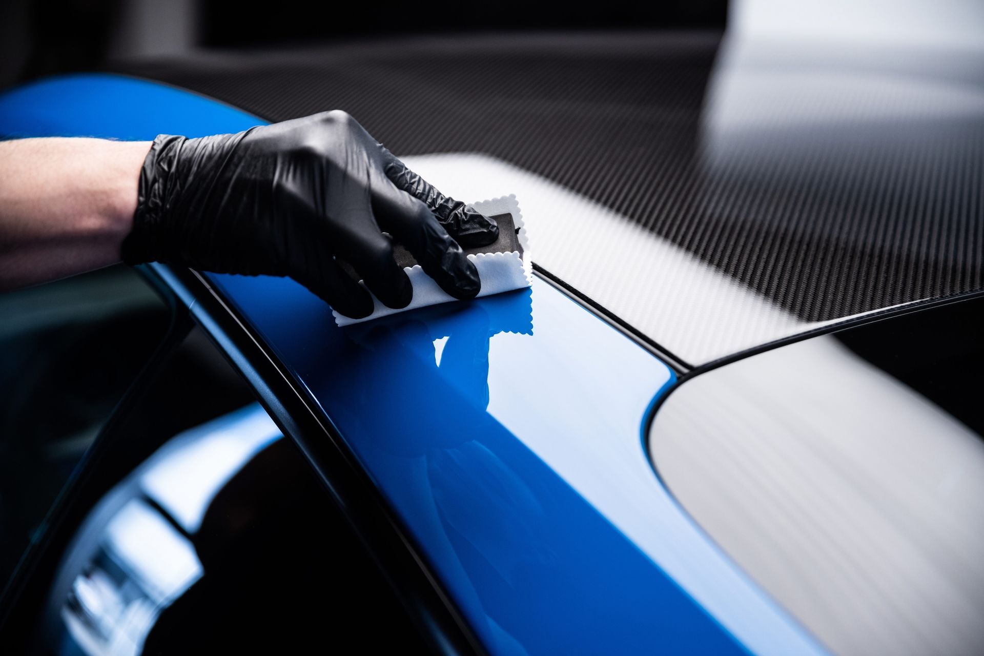 Ceramic coated sports car under studio lighting at Motorcity Detailing in Huntsville